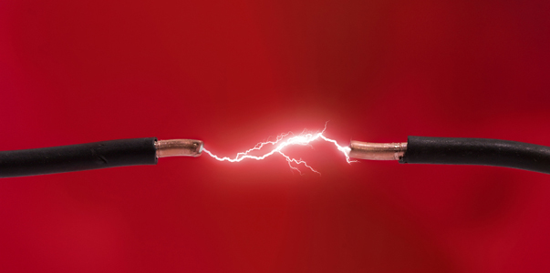 Electrical spark between two wires (space for text).